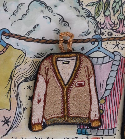 صورة تعليقة كنزة 🪡🧶  تطريز يدوي .