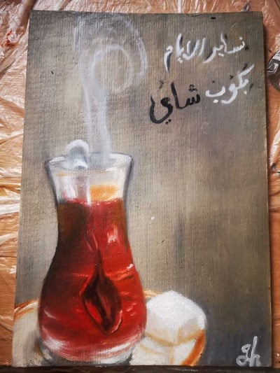 صورة عبارات على لوحه مرسومه يدويا